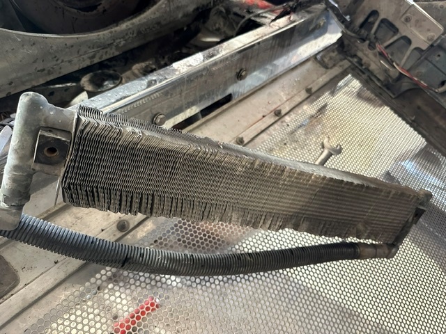 Dirty truck cooling component close-up showing severe restriction