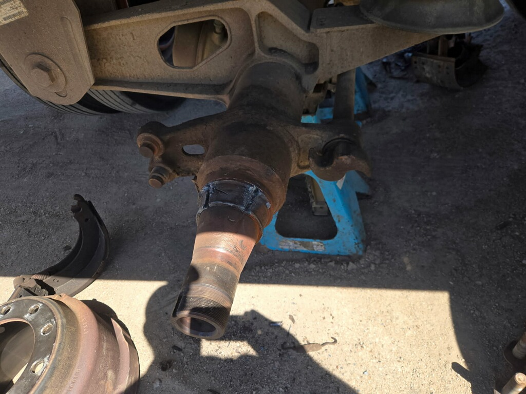 Leaking wheel seal and hub removed during trailer wheel-end repair
