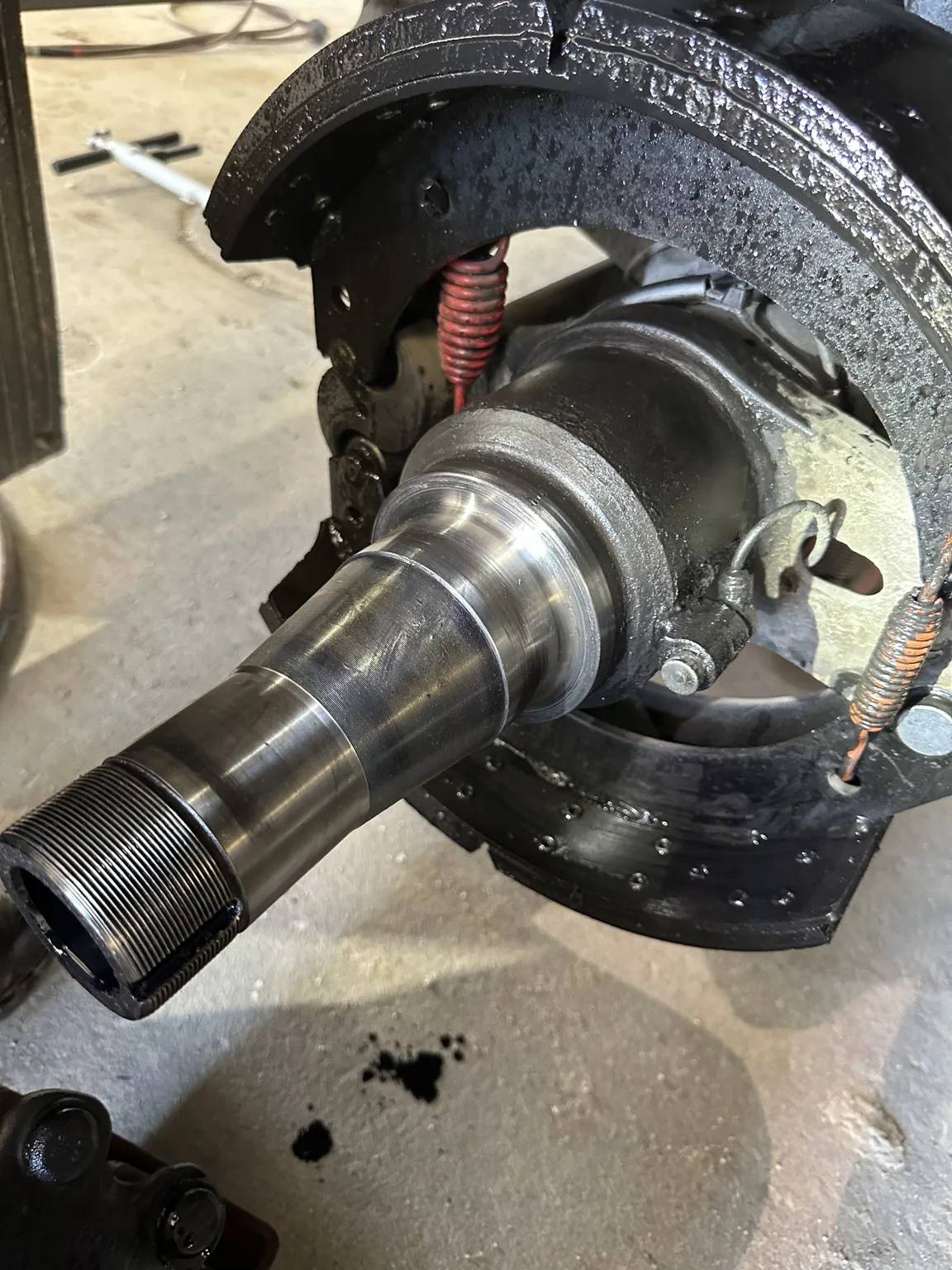 STS Truck Services technician working on heavy-duty truck wheel-end repair in the Blair shop